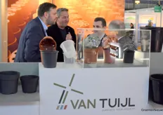 The men at the Van Tuijl booth are busy talking.